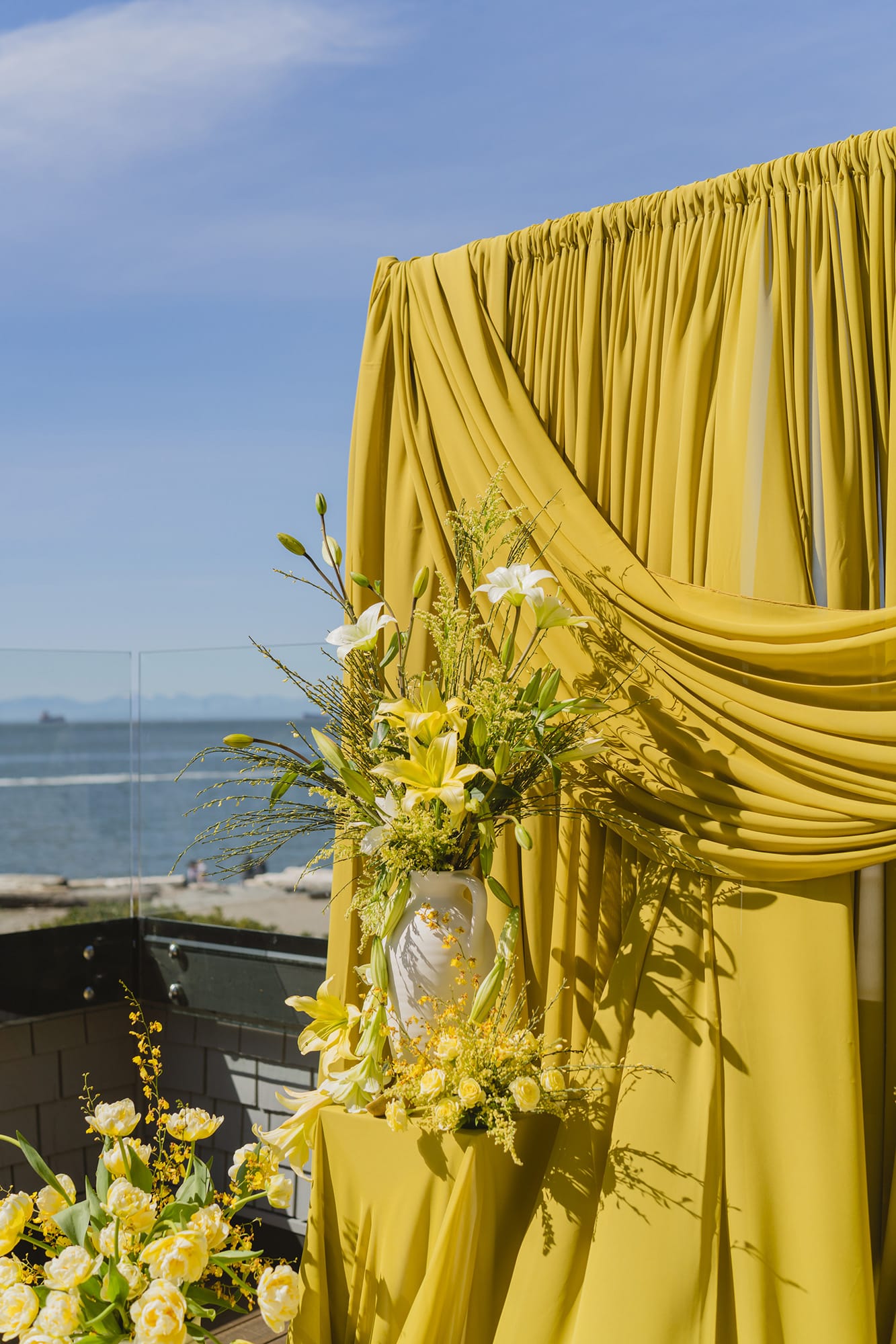 Yellow flowers against an oceanic backdrop for a wedding